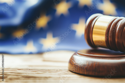 A wooden gavel resting on a European flag symbolizes court action and legal decisions across the continent. A powerful visual for themes of justice, law, and governance within the European legal syste photo