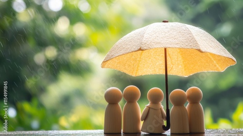 Wooden peg family under an umbrella, illustrating life, health, and travel insurance concepts. 