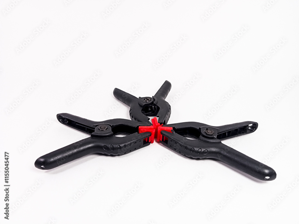 black plastic clamp isolated on white background, for industrial manufacturing plastic product catalog design