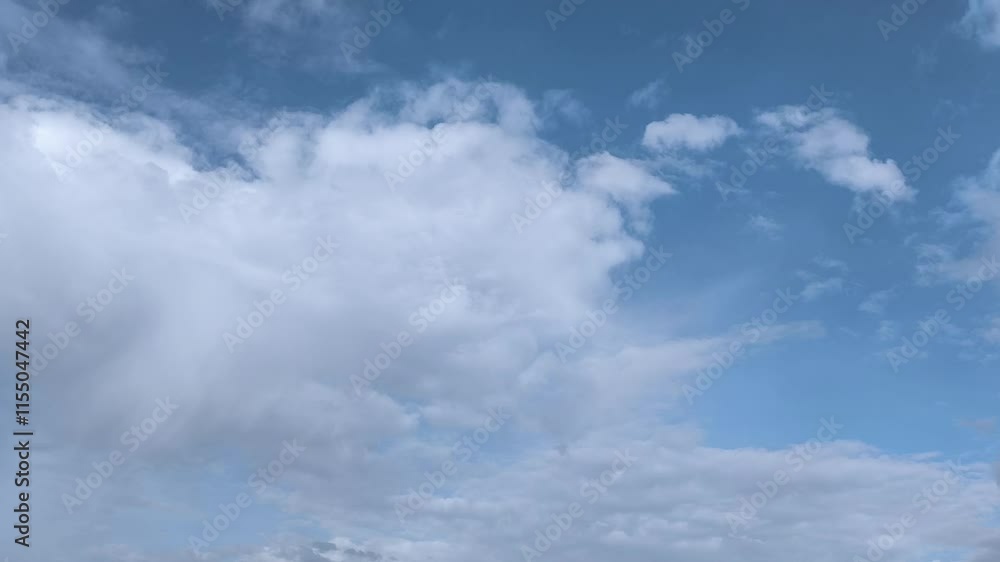 Cumulite clouds moving across the sky in the morning Cumulite clouds moving across the sky in the morning