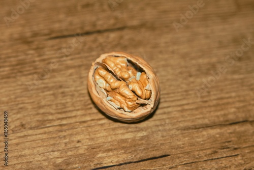 a whole walnut, an open walnut and other pieces photo