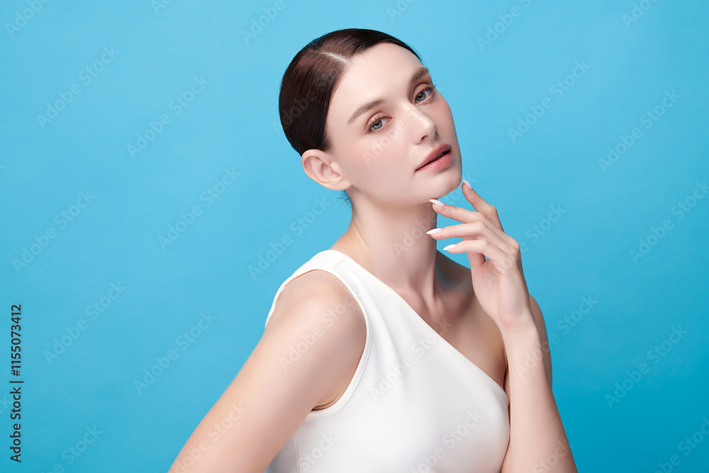 Beautiful young woman with clean fresh skin on blue background, Face care, Facial treatment, Cosmetology, beauty and spa, women portrait. Beautiful young woman with clean fresh skin on blue background, Face care, Facial treatment, Cosmetology, beauty and spa, women portrait.