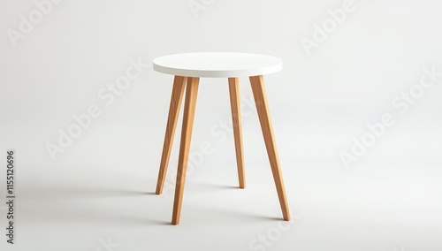 Small white round top table with light wood legs on white background.