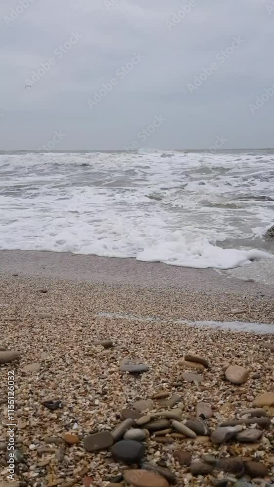 Sea waves run to the stone shore