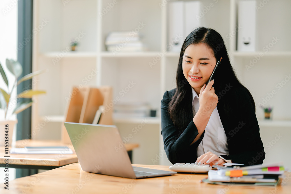 Cheerful businesswoman using smartphone to chat at office Cheerful businesswoman using smartphone to chat at office