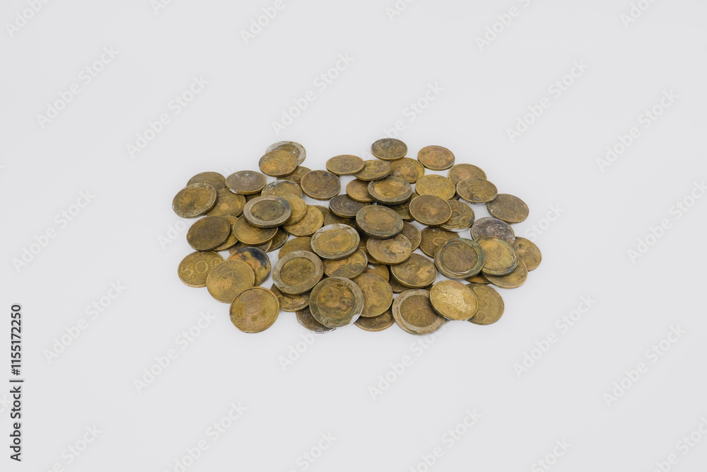 A collection of coins scattered and isolated on a white background. Concept of money saving and investment, business finance, taxes, and banking. A collection of coins scattered and isolated on a white background. Concept of money saving and investment, business finance, taxes, and banking.
