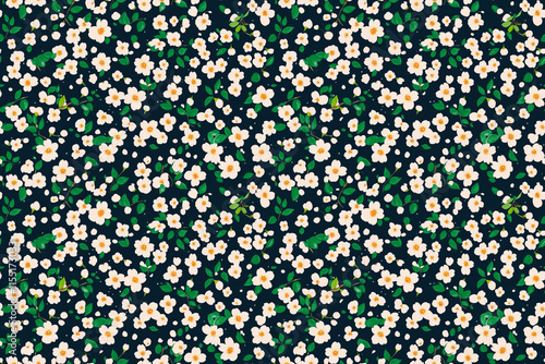 Dense floral seamless pattern with tiny white flowers on a dark green background. A classic and natural composition. photo