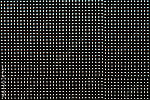 Blurred photo of video wall screen on black background with pixel grid layout for digital panel LED display with mesh diodes.
