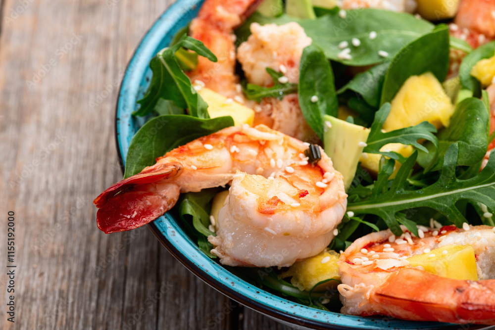 Salad with tiger shrimps , avocado and mango . Top view Salad with tiger shrimps , avocado and mango . Top view