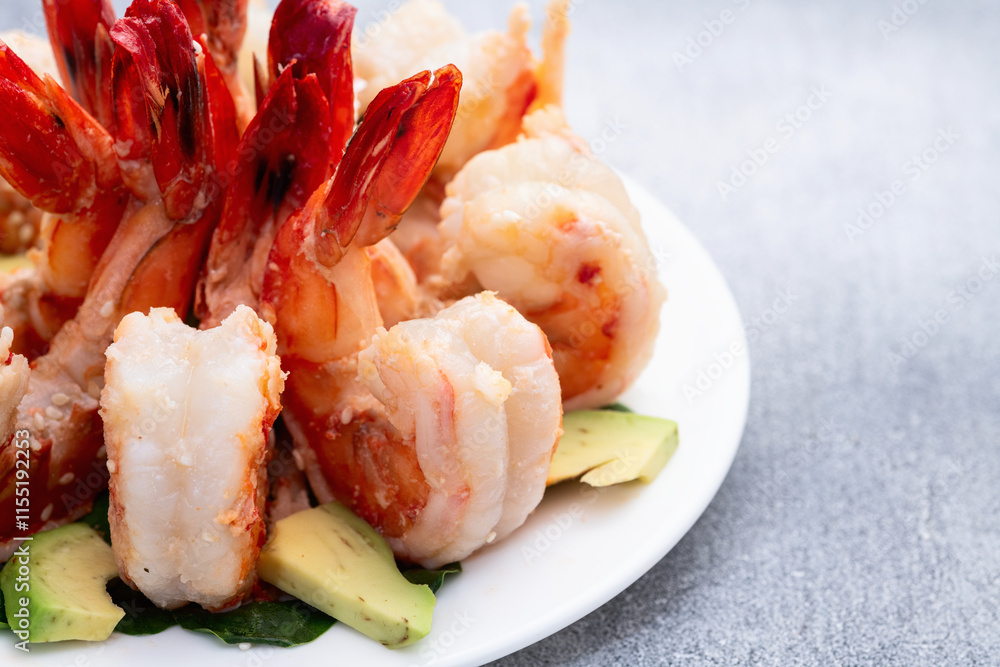 Salad with tiger shrimps , avocado and mango . Top view Salad with tiger shrimps , avocado and mango . Top view
