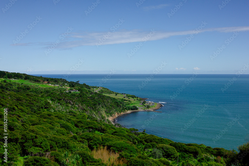 Panoramic view over high coast of Tasman Sea on an overcast summer day. High vantage point. Raglan, New Zealand Panoramic view over high coast of Tasman Sea on an overcast summer day. High vantage point. Raglan, New Zealand