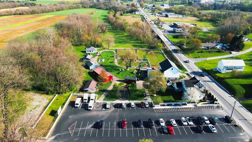 Принти на полотні Aerial view of Amish Village in Pennsylvania, capturing the serene countryside, traditional Amish homes, farmland, and horse-drawn buggies, offering a peaceful glimpse into rural life