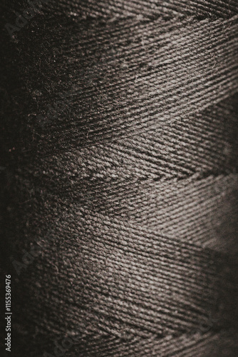 macro photography black spool of thread close up