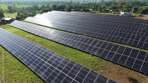 Drone flying over a solar panel park in 4K, showcasing renewable energy. photo