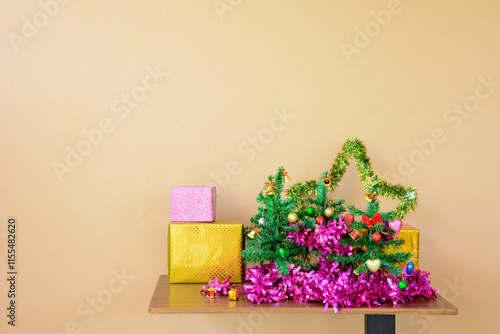 Small Christmas Tree with Decorative line and Gift Boxes on Table