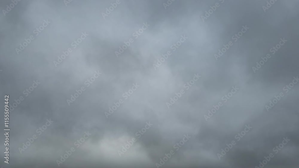 Dark and illuminated clouds move by at dawn Dark and illuminated clouds move by at dawn
