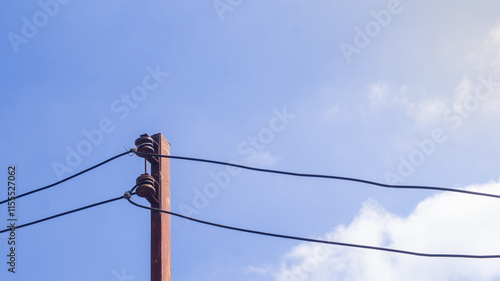 Wallpaper Mural Electrical poles in the countryside It is made of iron and has two wires attached to the background of the sky and clouds. Torontodigital.ca