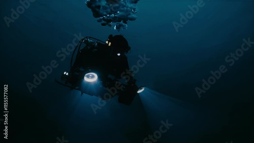 A submersible is exploring the serene and calm depths of the ocean, illuminated beautifully by powerful lights