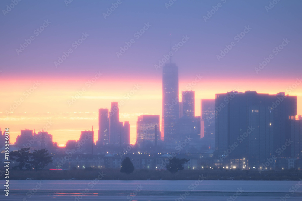 Fototapeta premium Stunning manhatta NYC skyline during sunrise winter season, far away skyline taken from New Jersy side, copy space travel world famous destination