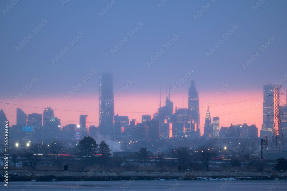Fototapeta premium Stunning manhatta NYC skyline during sunrise winter season, far away skyline taken from New Jersy side, copy space travel world famous destination