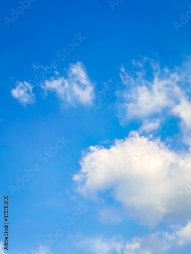 Clouds floating in blue sky.