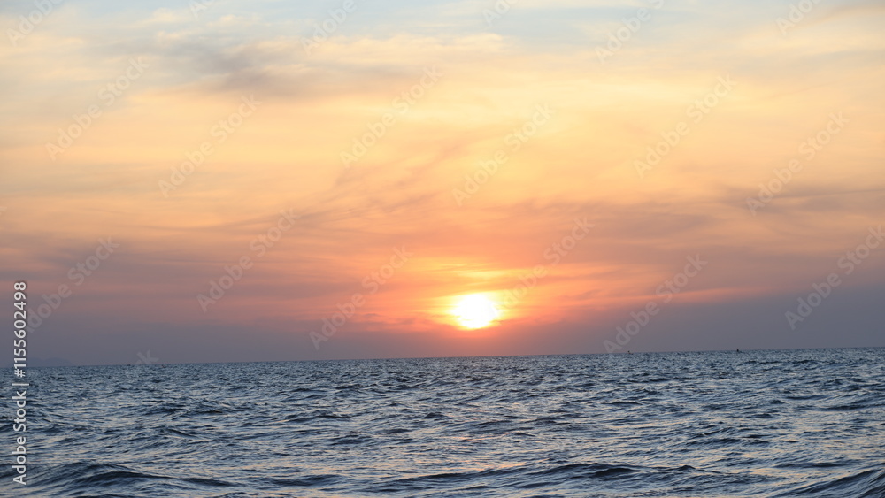 Obraz premium Horizon Sea Sky Background, Sunset sky clouds over the sea in the evening with Orange and yellow sunlight Golden hour in the Summer landscape, Dusk sky seascape backgrounds