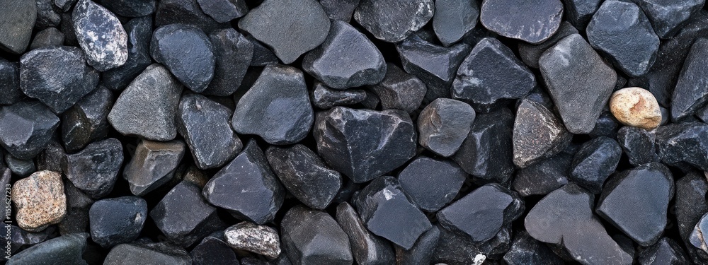 Close-up of dark gray and black pebbles. Close-up of dark gray and black pebbles.