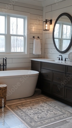 Modern bathroom design featuring a freestanding tub and elegant vanity with n...