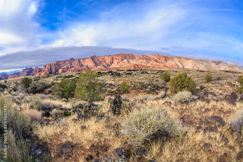 A desert landscape with a mountain in the background A desert landscape with a mountain in the background