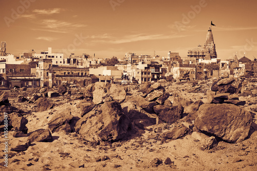 Gomti Ghat and Hindu temple Shree Dwarkadhish. View from other side of the river Gomti. Dwarka, Gujarat, India photo