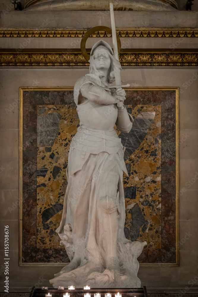 Obraz premium Paris, France - 12 18 2024: View detail of Joan of Arc statue inside Madeleine church.