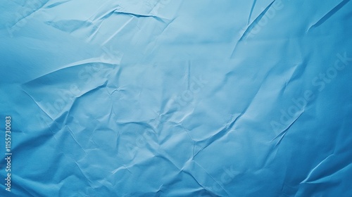 top view on light blue color crumpled paper, texture background  