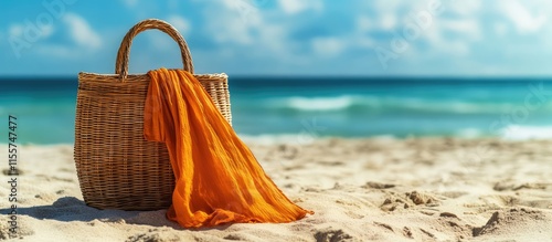 Wicker beach bag and orange dress on sandy shore with blue sky relaxing summer scene highlighting serenity and vacation vibes #1155747477