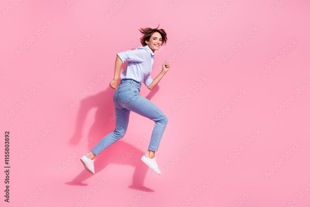 Full length profile portrait of nice cheerful person jump run hurry empty space isolated on pink color background Full length profile portrait of nice cheerful person jump run hurry empty space isolated on pink color background