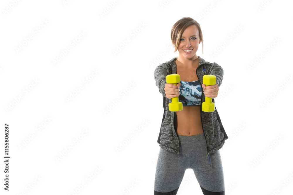 Beautiful young fitness model poses in jacket, sports bra and leggings in studio holding dumbbells Beautiful young fitness model poses in jacket, sports bra and leggings in studio holding dumbbells