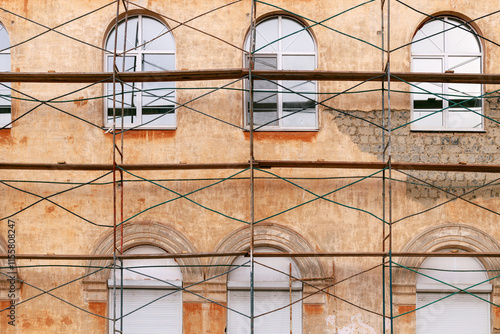 Fototapeta Naklejka Na Ścianę i Meble -  scaffolding at the wall of the old building