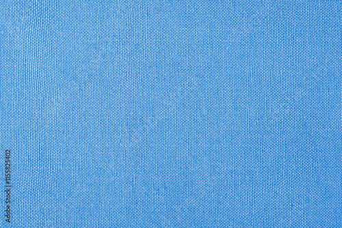 Light blue fabric as a background macro photo. Blue background