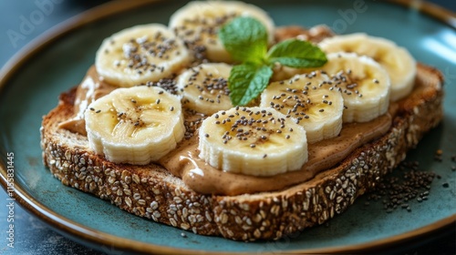Delicious banana and peanut butter toast on whole grain bread with chia seeds