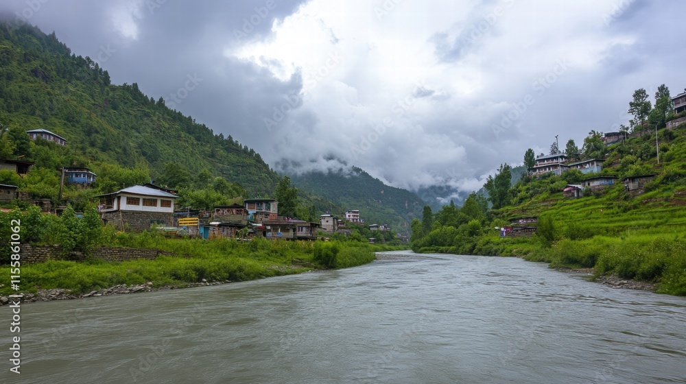 Fototapeta premium Serene River Valley: Houses nestled in lush greenery alongside a calm river, mountains and clouds in the background. A picturesque scene of tranquility and natural beauty.
