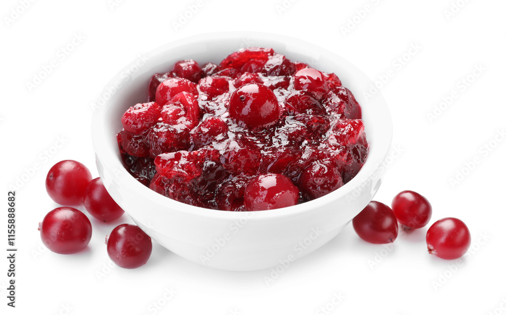 Tasty cranberry sauce in bowl and berries isolated on white Tasty cranberry sauce in bowl and berries isolated on white
