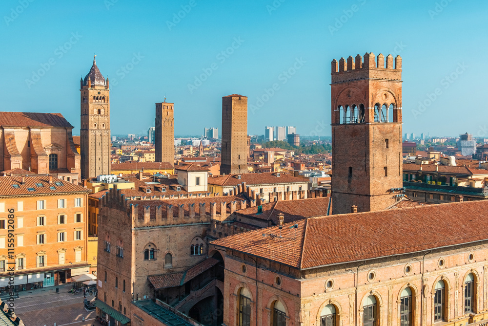 Fototapeta premium Aerial view of Piazza Maggiore in Bologna old town, Emilia Romagna, Italy, with historic architecture, Palazzo del Podesta and towers at sunrise. Italian cityscape. Travel destination in Europe