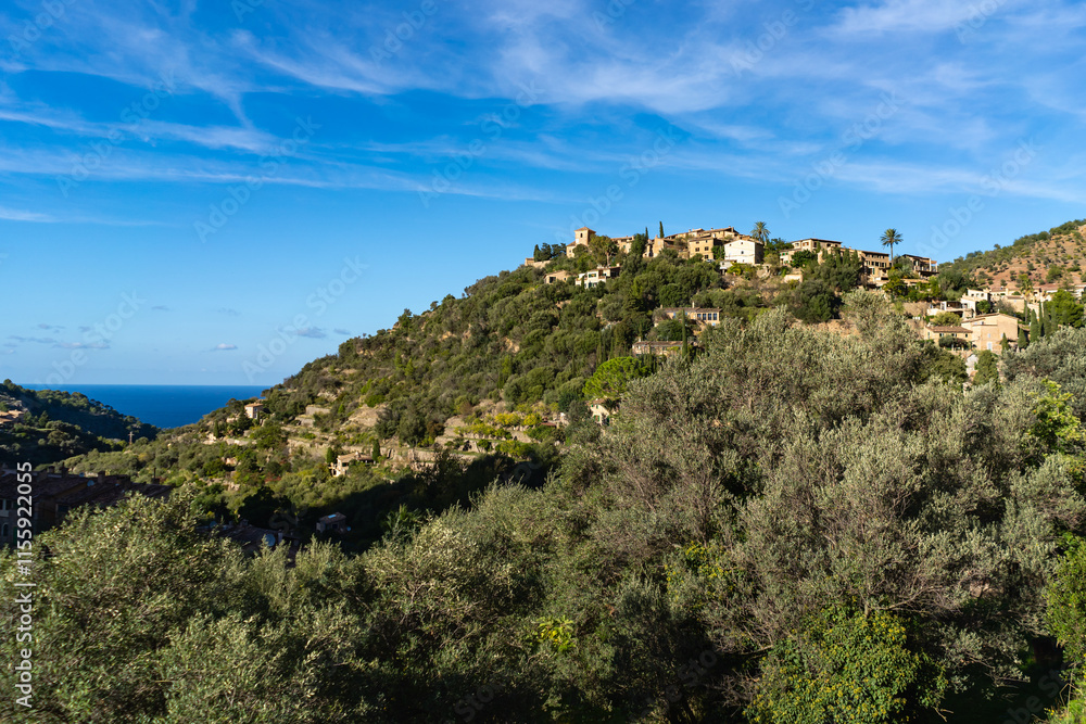 Obraz premium Deia, Mallorca, Spain 26.10.2021 Hillside village with Mediterranean sea view and traditional stone houses on mountain slope