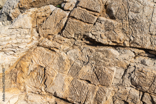Capdepera, Mallorca, Spain 26.10.2021 Natural limestone rock formation showing layered texture and geological patterns in sunlight.