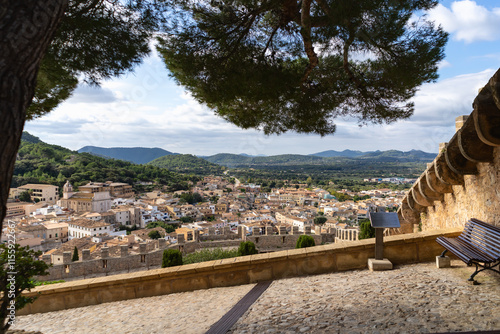 Capdepera, Mallorca, Spain 26.10.2021 Mountain landscape and Mediterranean town view from castle terrace with pine tree frame