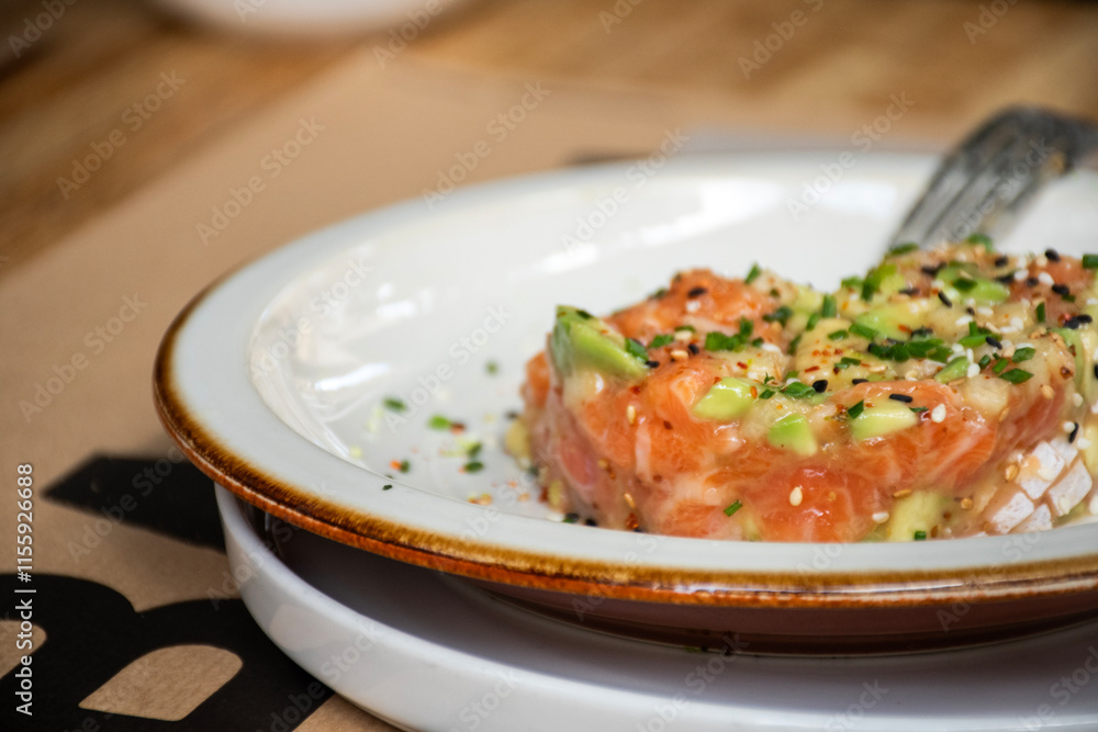 raw salmon tartar in meal in chic close-up raw salmon tartar in meal in chic close-up