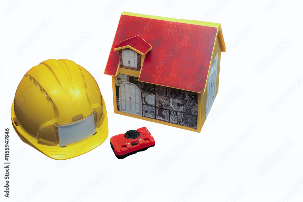 Construction helmet, laser level, and model house illustrating home renovation planning