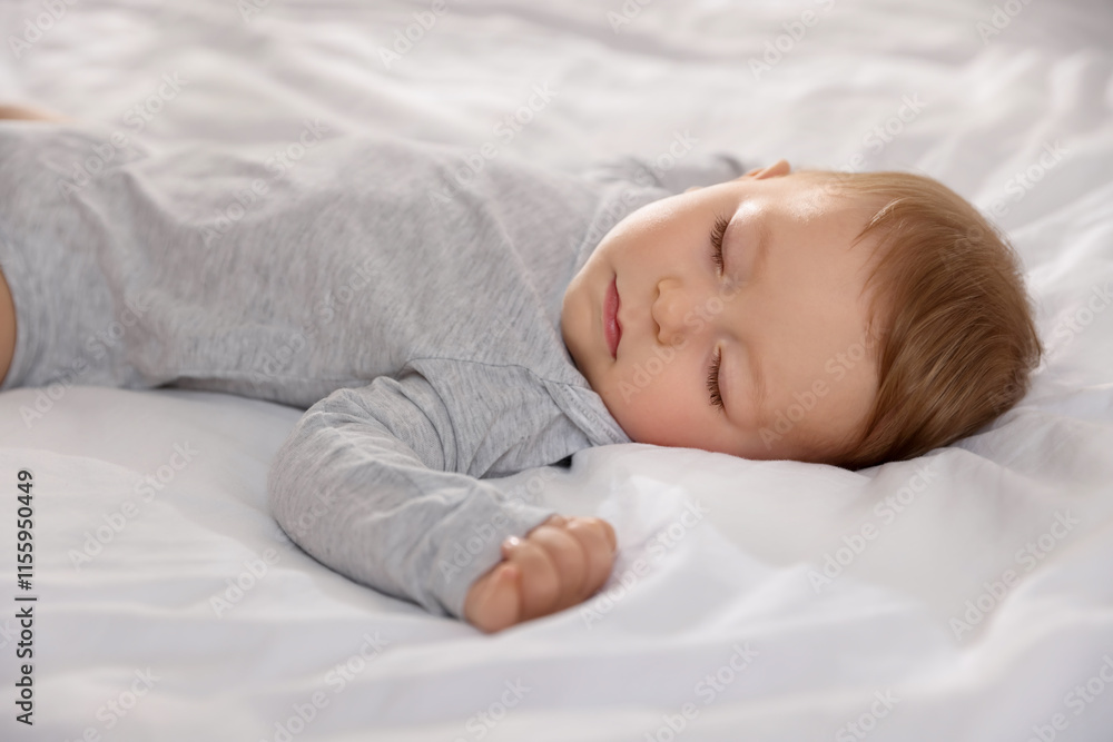 Cute little baby sleeping on bed at home Cute little baby sleeping on bed at home