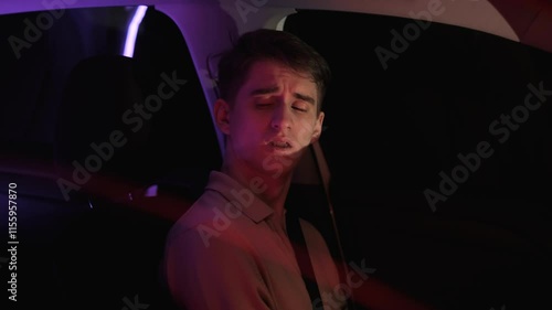 Drunk sleepy culprit of traffic accident yawning in car after accident