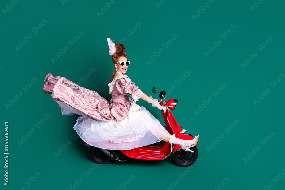Fototapeta premium Retro meets modern: aristocratic woman in a pink baroque dress and red scooter