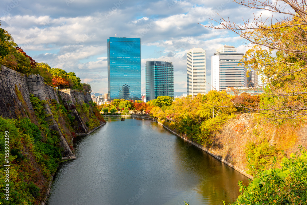 Obraz premium East Outer moat of Osaka castle with Business Park skyscrapers in autumn, Osaka, Japan
